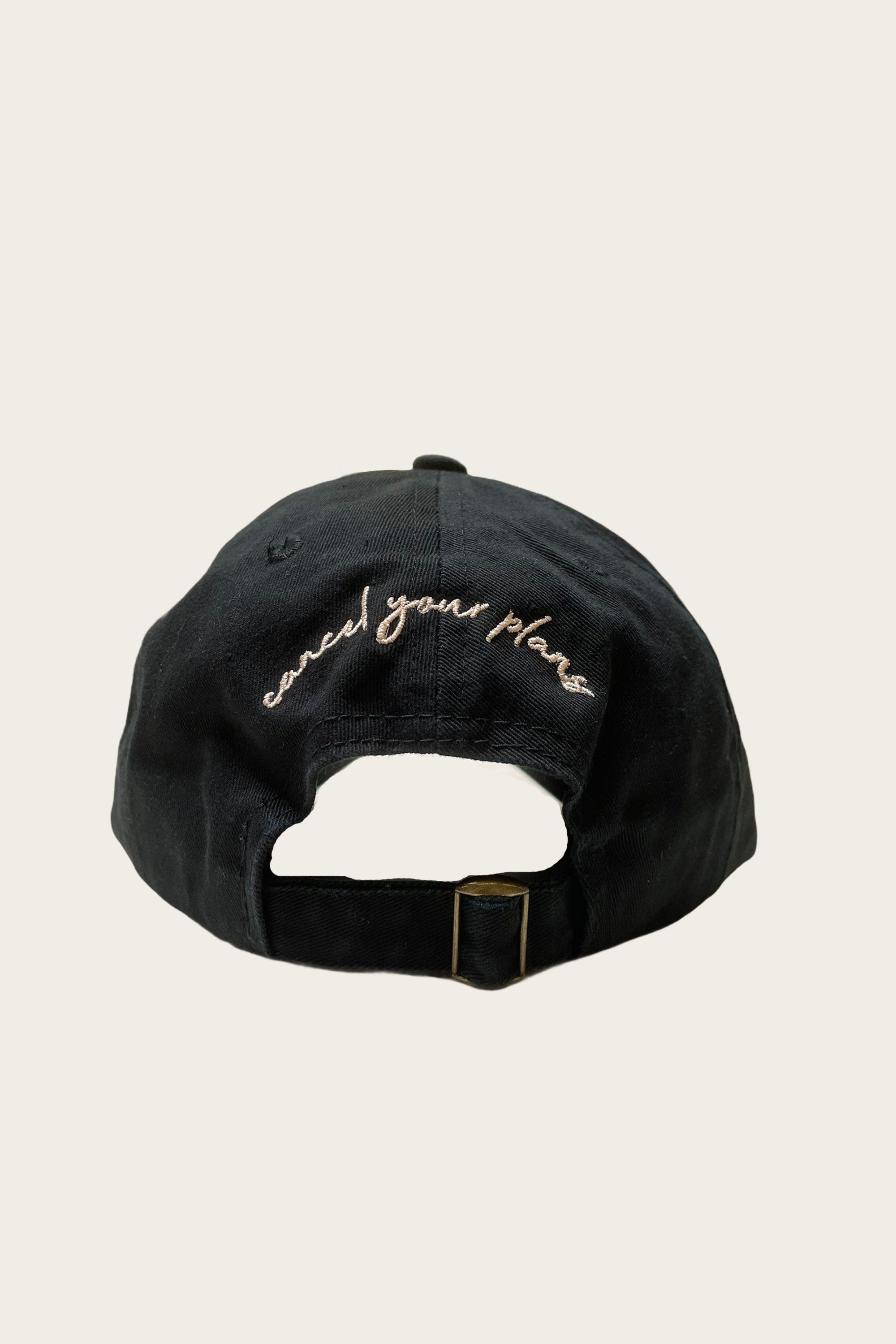 Load image into Gallery viewer, Back of the hat featuring a ponytail opening and an adjustable strap with &quot;cancel you plans&quot; written over the opening
